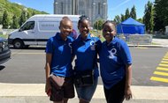 Gracia with 2 friends dressed in blue in front of Sainte-Anne-de-Beaupré basilica