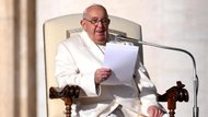 Pope preaching from his chair while holding his script