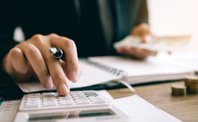 Hand typing. Image illustrating an article about financial management in Opus Dei