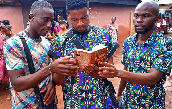 Guests reading at the funeral