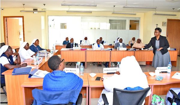 Dr. Njiraini, Academic Lead for the SBVP, takes the sisters through a training session - Kenya